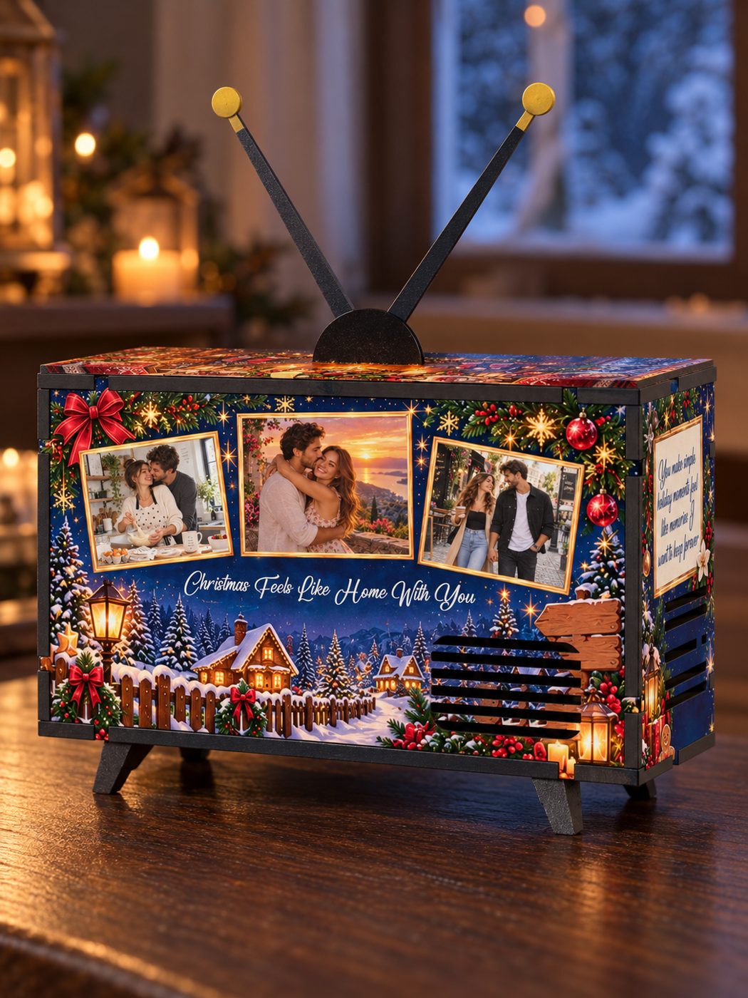 Winter Love Story Mini TV with three photos printed on its front, on a table by a snowy window